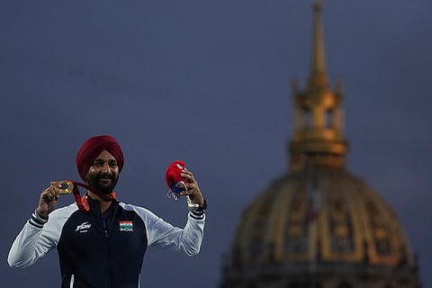 2024 Paralympic Games Archery: Harvinder Singh celebrates on the podium after winning the gold medal